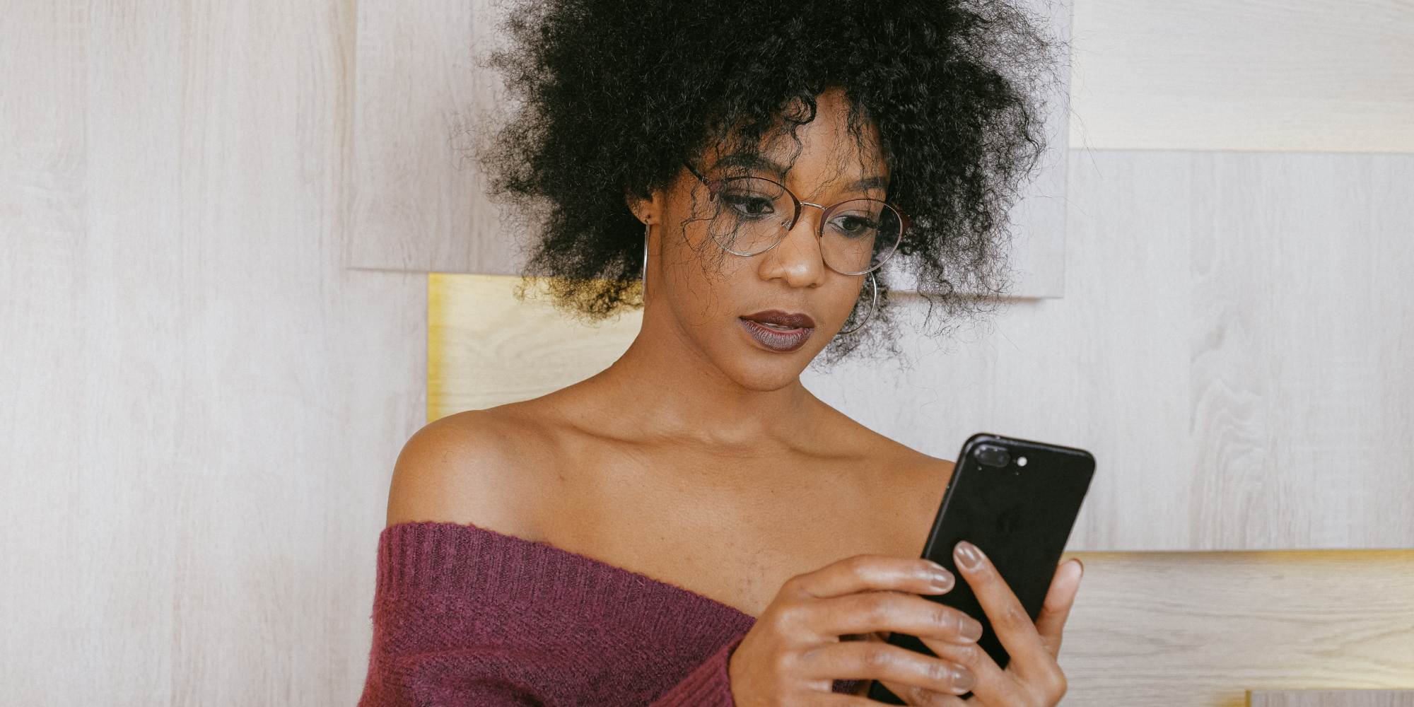 Woman searching on her phone "What are the different types of abortion and when can you have them?"